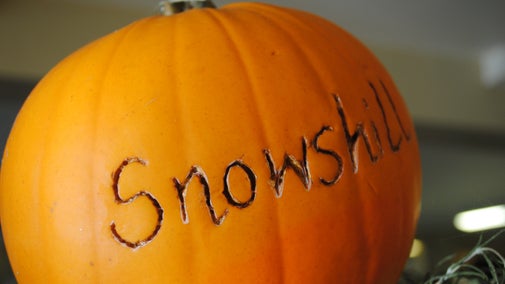 A pumpkin with the name 'Snowshill' carved across the middle